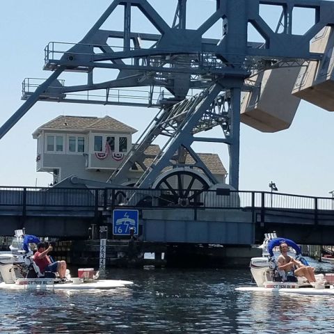 a group of people on a boat in the water
