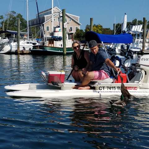 people having a good time on their boat in the water
