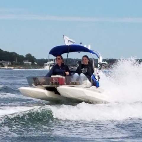 a group of people on a boat in the water