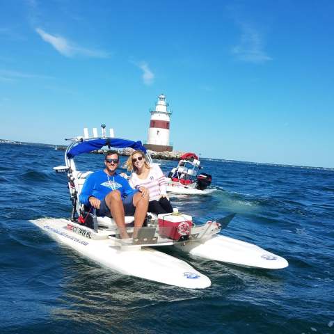 a group of people on a boat in the water