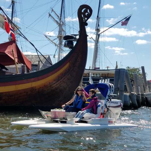 a group of people on a boat in the water