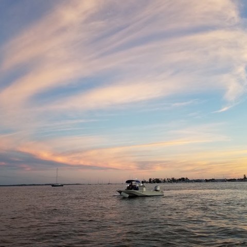 a group of people on a boat in the water