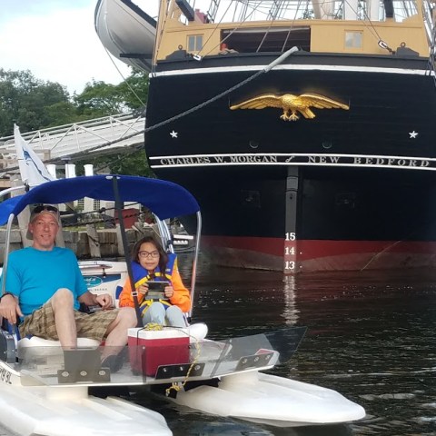 a group of people on a boat in the water