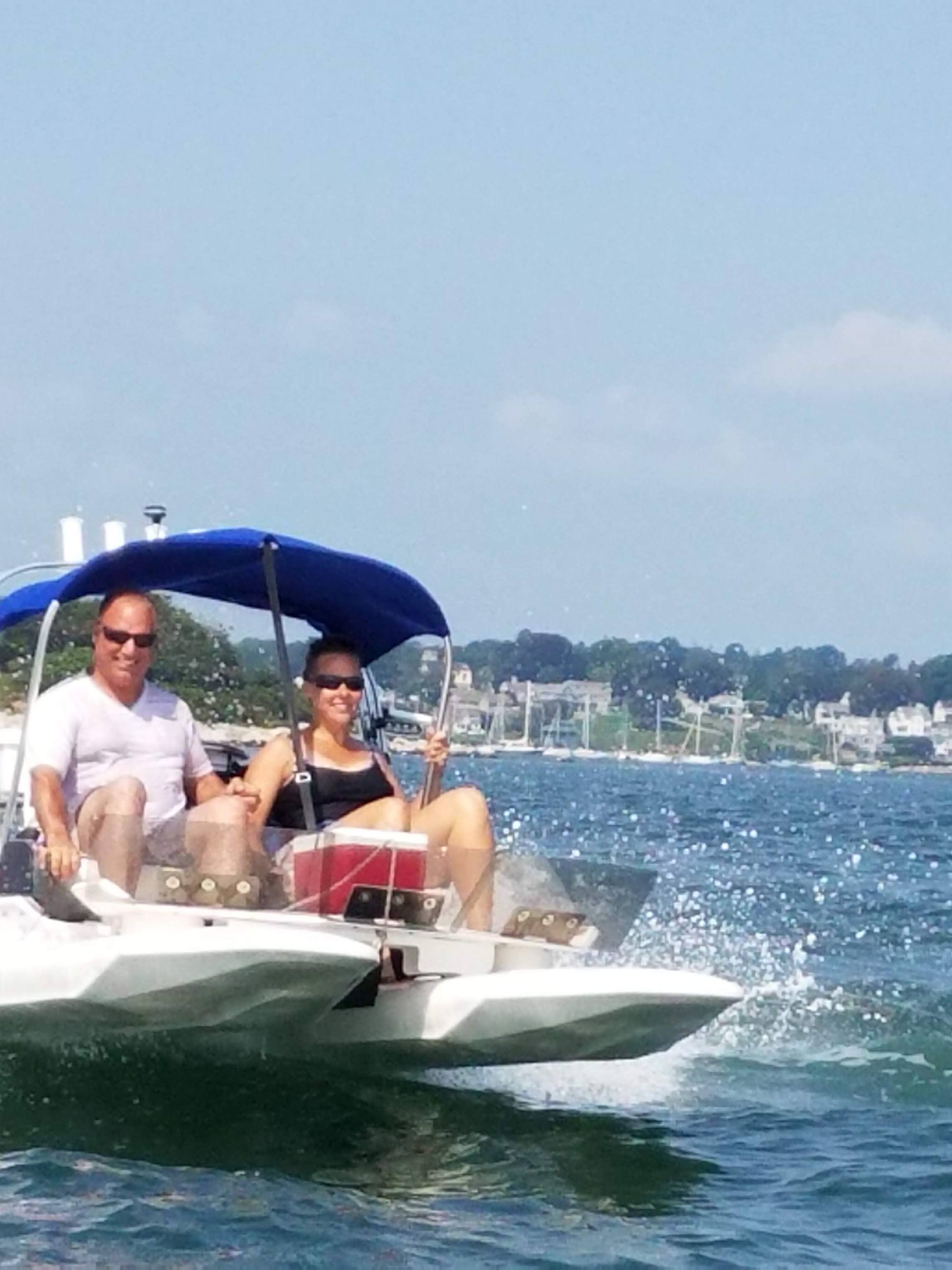 Boaters driving small vessel