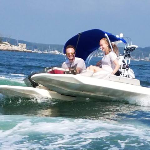 Driving small boat through Mystic River