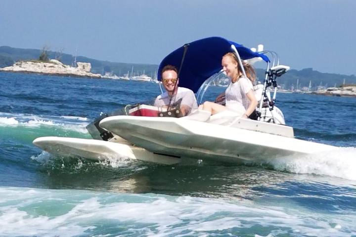 Driving small boat through Mystic River