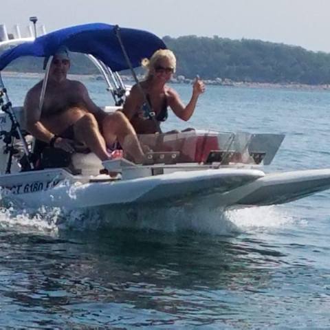 a group of people on a boat in the water