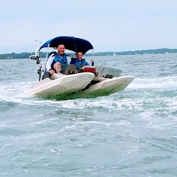 a man riding a boat in the water