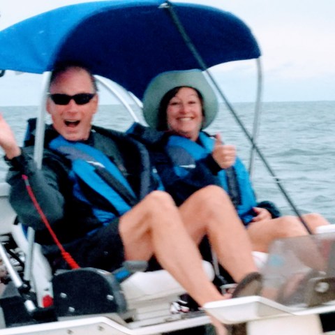 Two boaters smiling at camera
