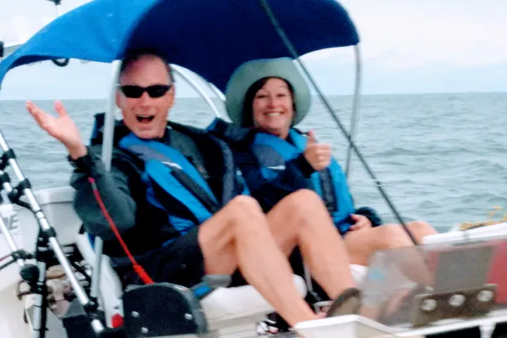 Two boaters smiling at camera