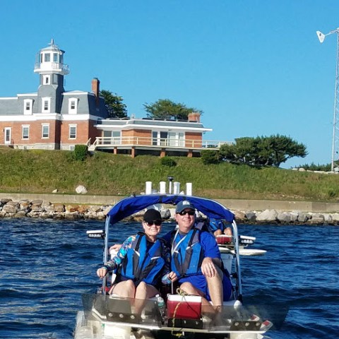 a group of people on a boat in the water