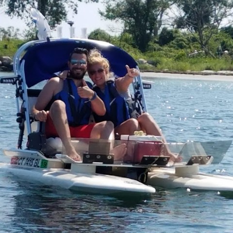 a group of people on a boat in the water