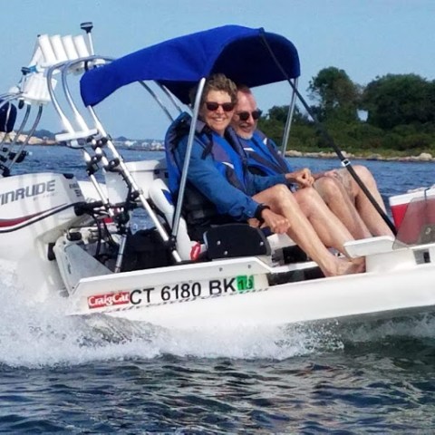 a group of people on a boat in the water