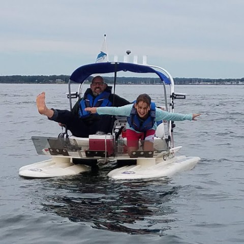 a group of people on a boat in the water