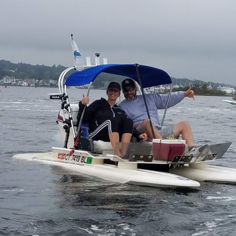 a group of people on a boat in the water