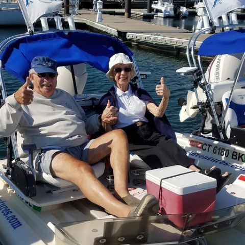 a group of people on a boat in the water