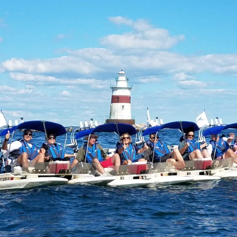 a group of people on a boat in the water