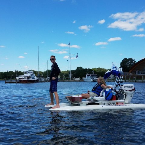 a group of people in a boat on a body of water