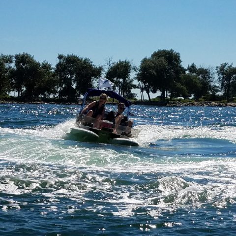 a person riding a surf board on a body of water