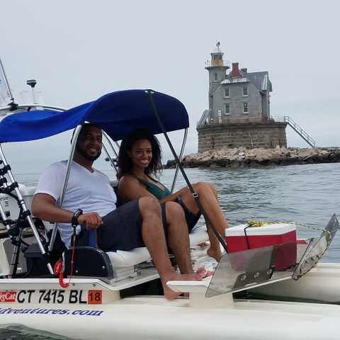 a person sitting on a boat in the water