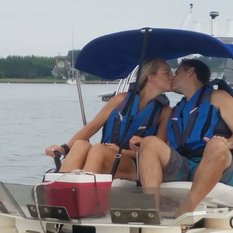 a man and a woman sitting on a boat