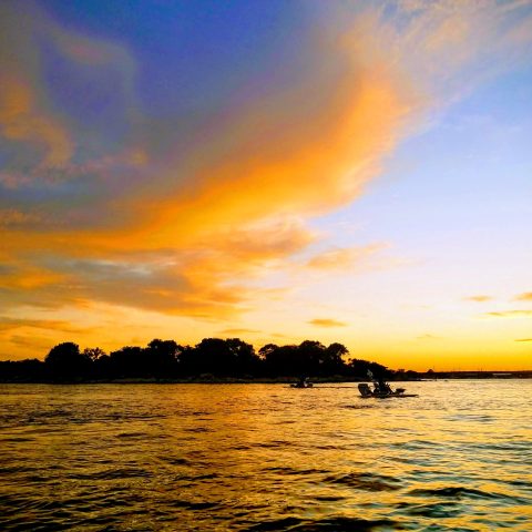 a sunset over a body of water