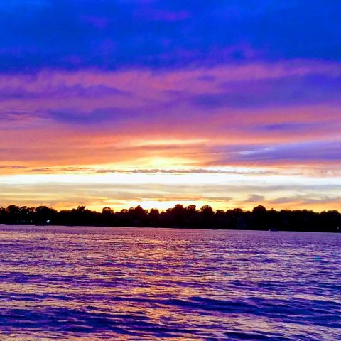 a sunset over a body of water