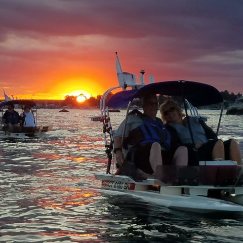 a group of people in a boat on a body of water